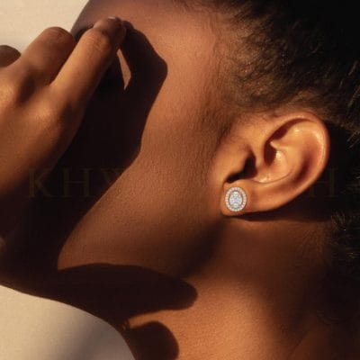 Close-up view of a model wearing Infinite Dazzles Diamond Stud Earrings in rose gold.