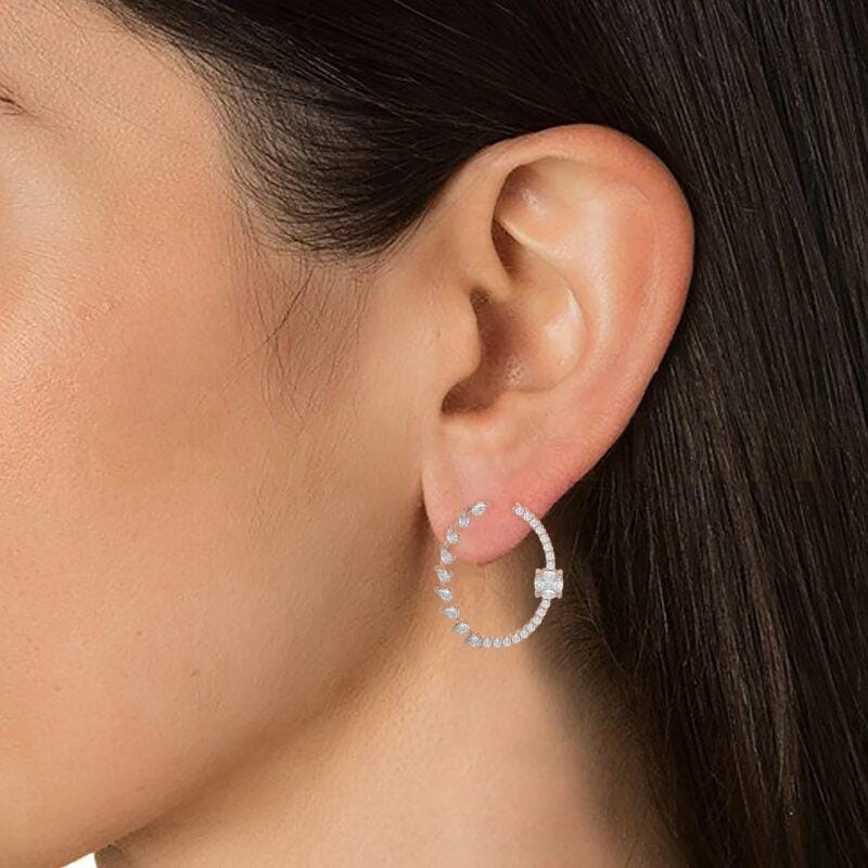Close-up view of a model wearing Blazing Bright Diamond Hoops in rose gold.