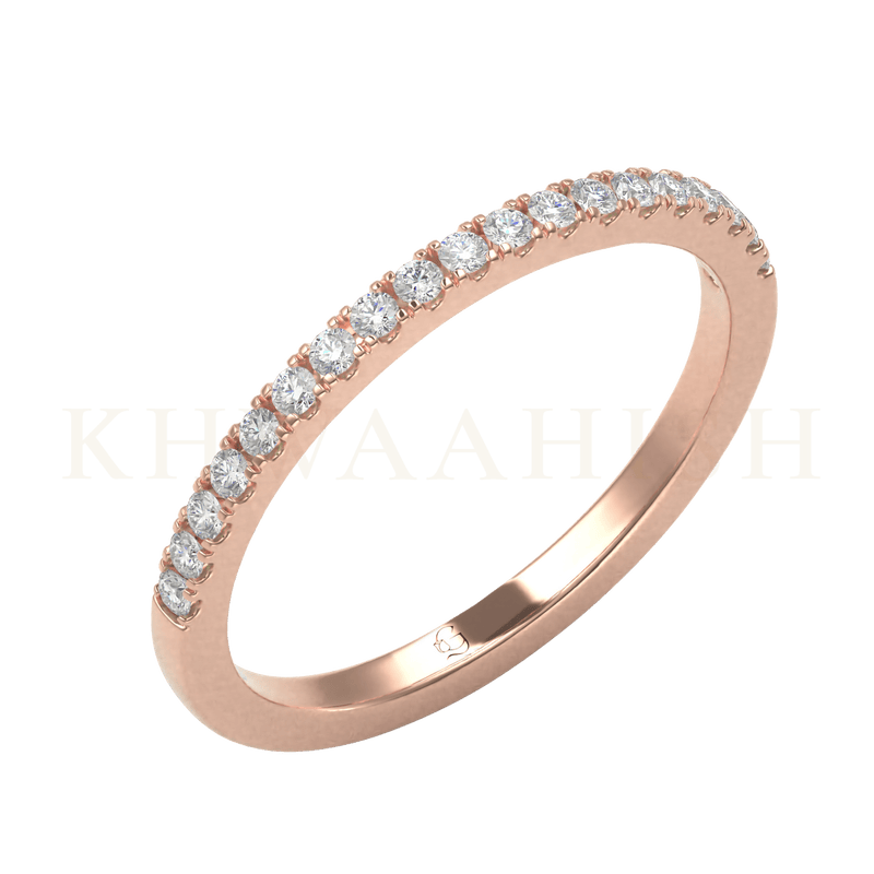 Slanting view of Quintessential Radiance Diamond Eternity Ring in rose gold.
