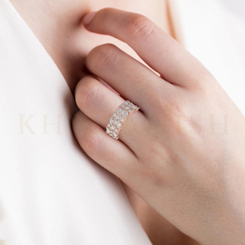Close-up view of a model wearing Princess Amelia Diamond Band Ring in rose gold.