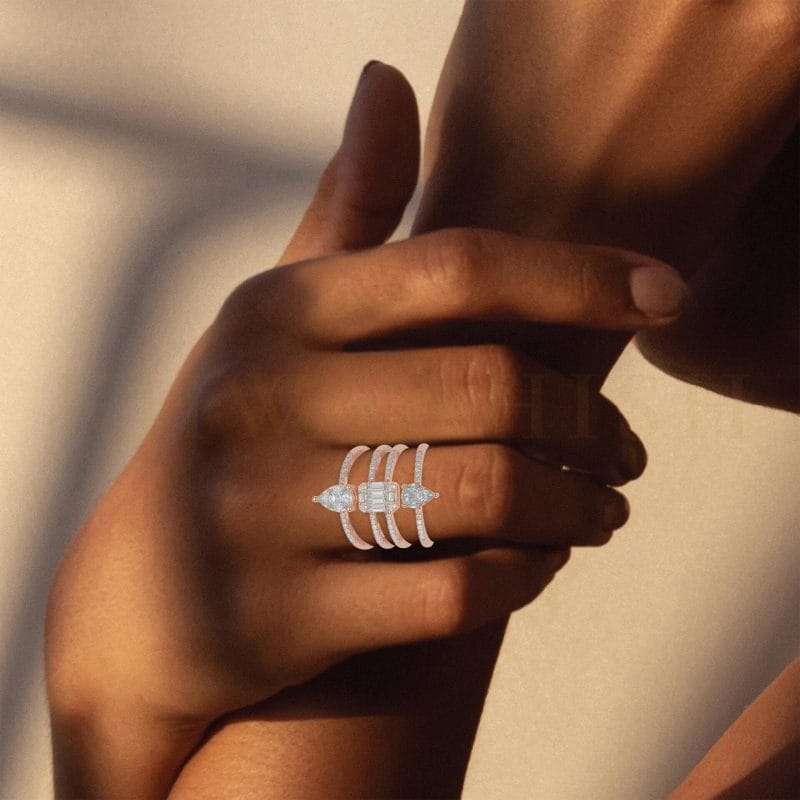 Close-up view of a model wearing Swivelling Sparkle Diamond Band Ring  in rose gold.