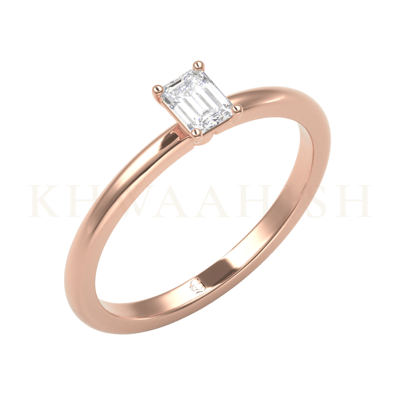Slanting view of 0.25 ct Gracefully Elegant Emerald Cut Solitaire Diamond Ring in rose gold.