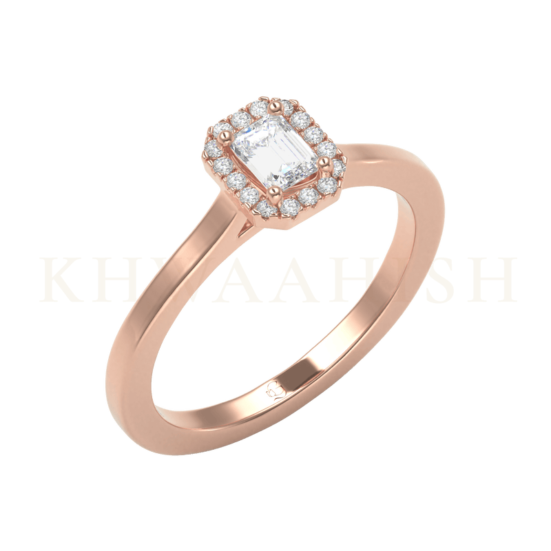 Slanting view of 0.25 ct Imperial Impressions Emerald Cut Solitaire Diamond Ring  in rose gold.