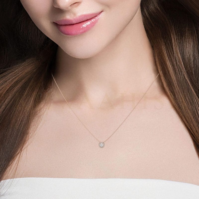 Close-up view of a model wearing 0.15 ct Empyrah Solitaire Diamond Necklace in rose gold.